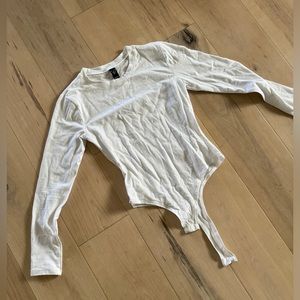 New without tags, white long sleeve bodysuit top size small.